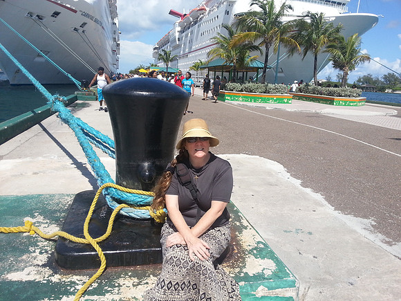 Me sitting at the Anchor Post of our boat.